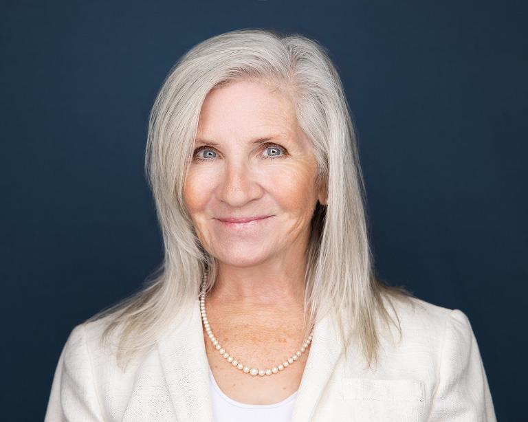 Lawyer Carolyn Kelly headshot wearing a suit
